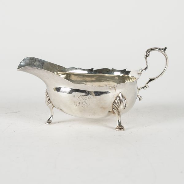 A GEORGE III NEWCASTLE SILVER SAUCEBOAT