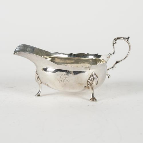 A GEORGE III NEWCASTLE SILVER SAUCEBOAT
