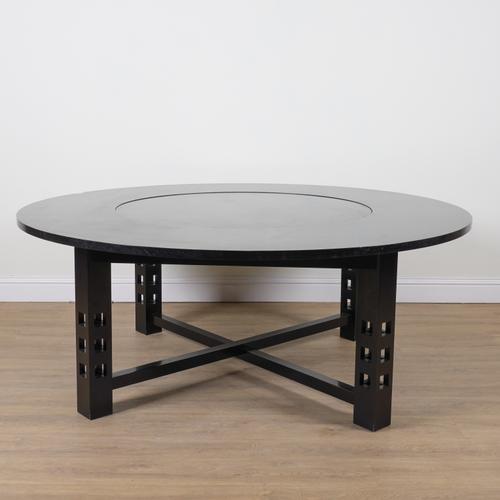 AFTER CHARLES RENE MACKINTOSH; AN EBONISED OAK CIRCULAR DINING TABLE
