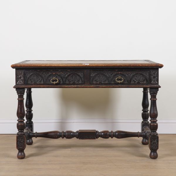 A VICTORIAN CARVED OAK TWO DRAWER SIDE TABLE