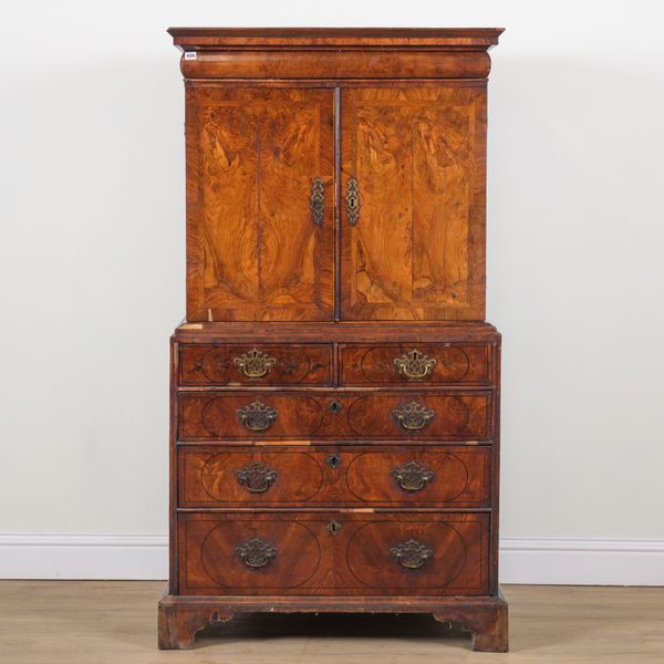 A 17TH CENTURY WALNUT CABINET ON CHEST