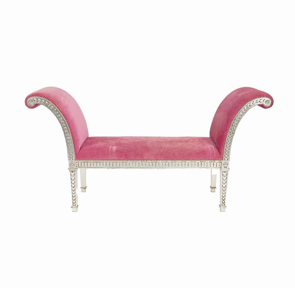 A SILVER FRAMED WINDOW SEAT