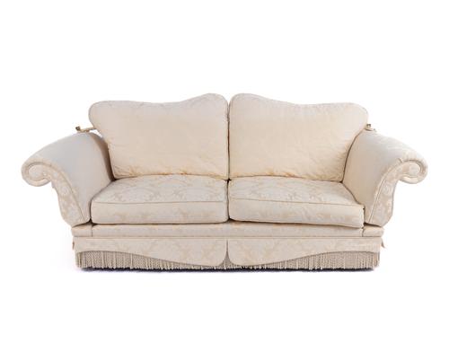 MILLBROOK AND CO; A THREE SEAT DROP ARM KNOWLE STYLE SOFA