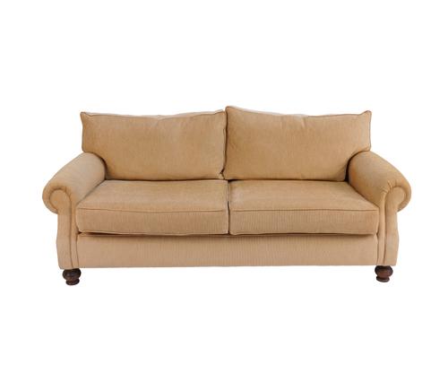 A SAND UPHOLSTERED TWO SEAT SOFA