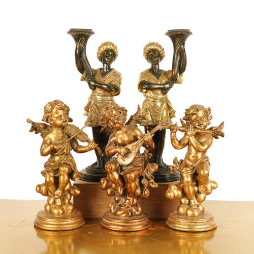 A PAIR OF MOORISH FIGURAL CANDLESTICKS (5)