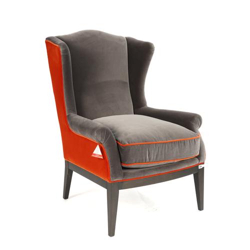 COACH HOUSE; A TANGERINE AND GREY UPHOLSTERED WINGBACK ARMCHAIR