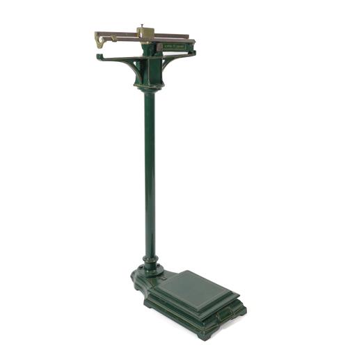A SET OF GREEN PAINTED IRON AND BRONZE FLOOR STANDING WEIGHING SCALES