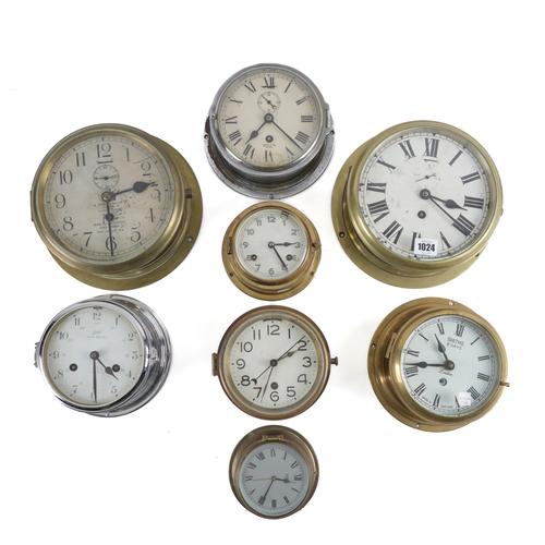 A GROUP OF EIGHT BULK HEAD CLOCKS (8)