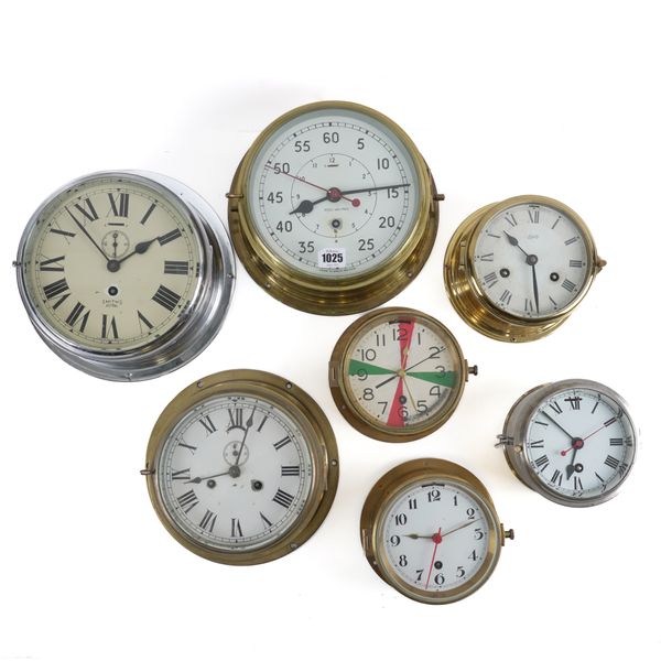 A GROUP OF SEVEN BULK HEAD CLOCKS (8)