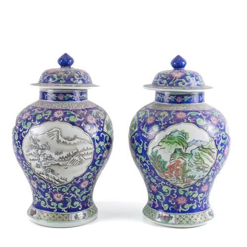 A PAIR OF CHINESE EXPORT FAMILLE ROSE AND BLUE GROUND BALUSTER VASES WITH COVERS (2)