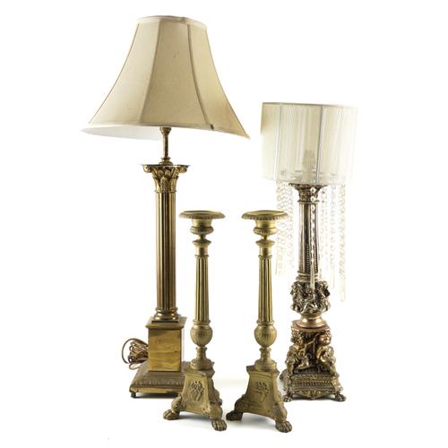A GILT-BRASS CORINTHIAN COLUMN TABLE LAMP AND ANOTHER WITH CHERUBS TO THE BASE (4)