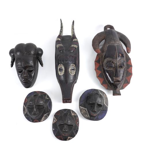 TRIBAL INTEREST: A GROUP OF MASKS INCLUDING AN IVORY COAST GURO ANTELOPE MASK (6)