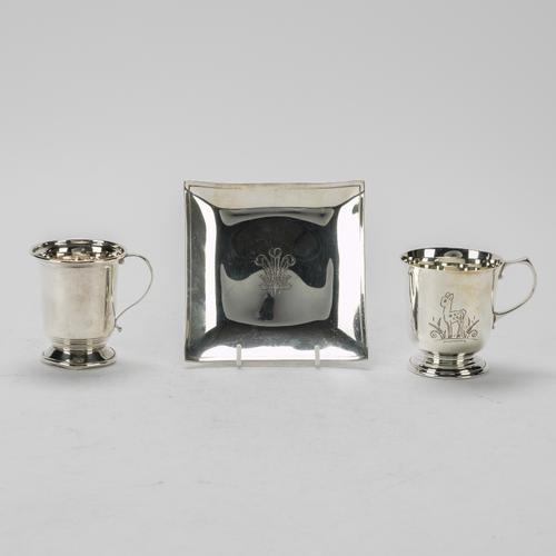 A SILVER SQUARE DISH AND TWO SILVER CHRISTENING MUGS (3)
