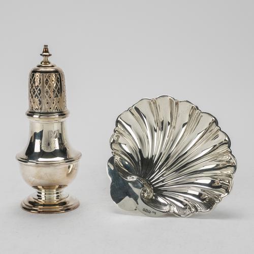 A SILVER SUGAR CASTER AND A SILVER BUTTER SHELL (2)