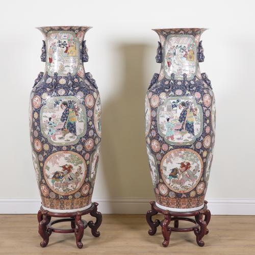 A PAIR OF LARGE SOUTH EAST ASIAN PORCELAIN BALUSTER VASES ON STANDS (2)