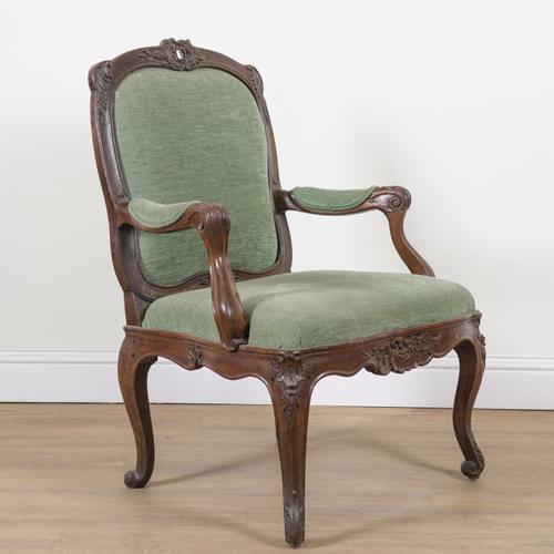 A LOUIS XV STYLE OAK FRAMED OPEN ARMCHAIR