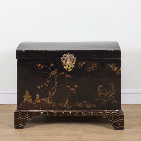 A CHINESE EXPORT BLACK LACQUER CHINOISERIE DECORATED DOME TRUNK
