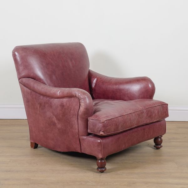 A ROUGE LEATHER UPHOLSTERED EASY ARMCHAIR