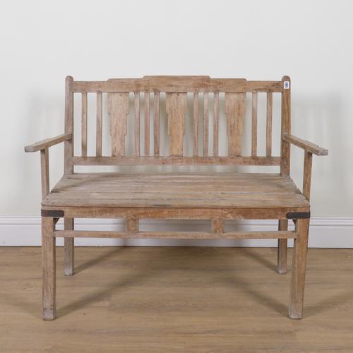 AN EARLY 20TH CENTURY TEAK BENCH