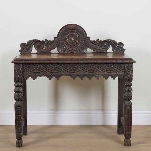 A VICTORIAN CARVED OAK SIDE TABLE