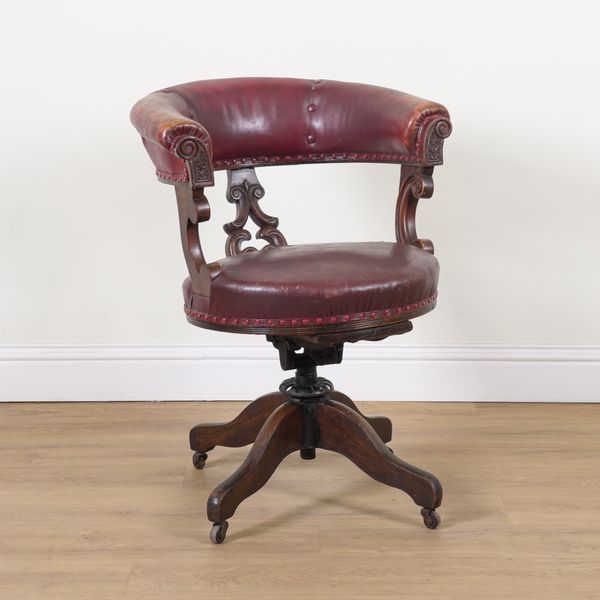 A VICTORIAN MAHOGANY FRAMED REVOLVING DESK CHAIR