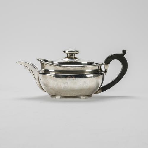 A GEORGE III SILVER TEAPOT