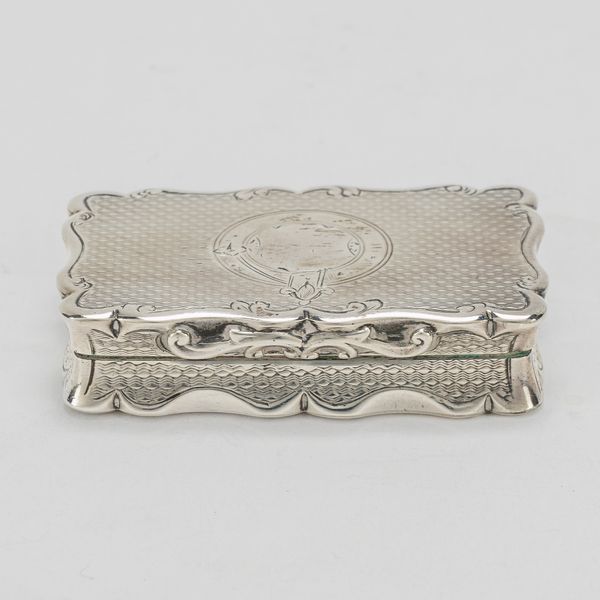 A VICTORIAN SILVER SHAPED RECTANGULAR SNUFF BOX