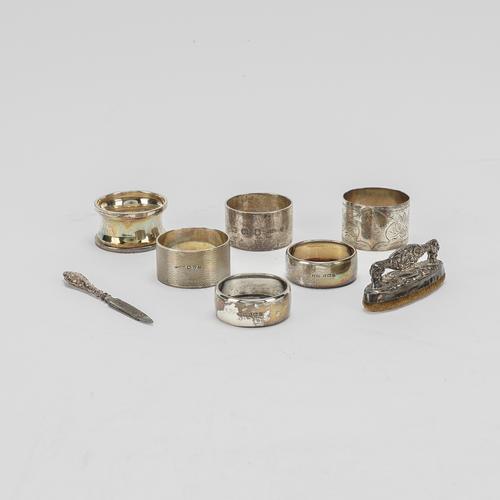 SIX SILVER NAPKIN RINGS AND TWO MANICURE IMPLEMENTS (8)