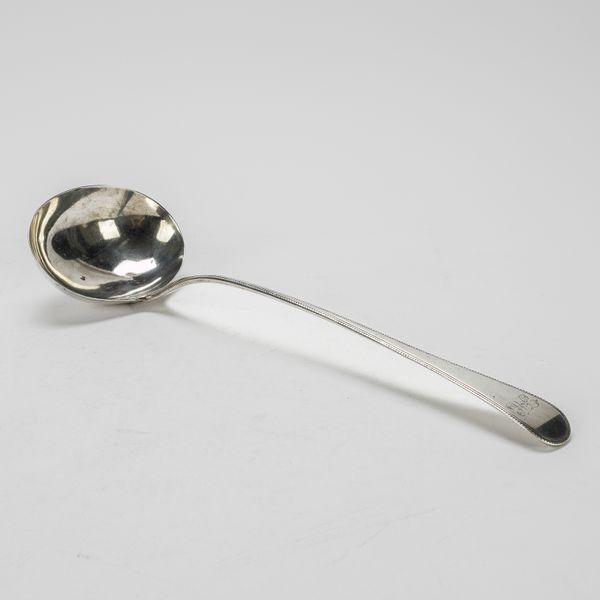 A GEORGE III SILVER BEAD EDGED OLD ENGLISH PATTERN SOUP LADLE