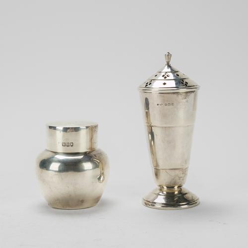 A SILVER SUGAR CASTER AND A SILVER TEA CADDY (2)