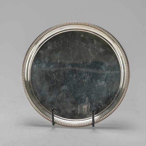 A SILVER CIRCULAR SALVER