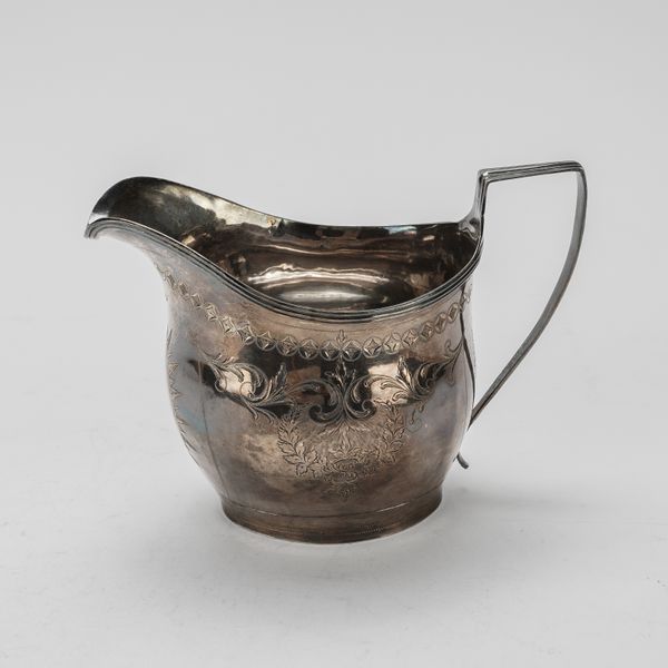 A GEORGE III SILVER MILK JUG