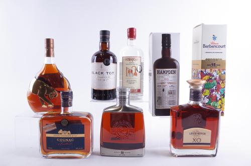 FOUR BOTTLES LUXURY RUM AND FOUR COGNAC