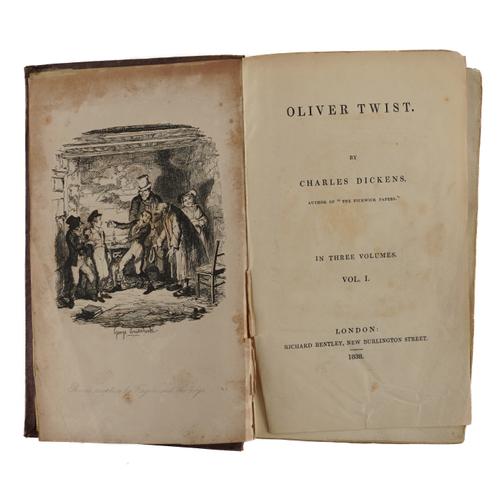 DICKENS, Charles (1812-70). Oliver Twist, London, Richard Bentley, 1838, 3 volumes, 8vo, half titles in vols. I and II [as called for], 24 etched plates by George Cruikshank, original plum cloth gilt. FIRST EDITION, second issue. (3)
