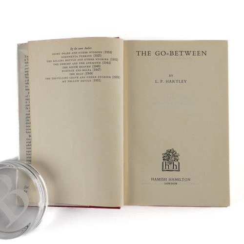 HARTLEY, L. P. (1895-1972). The Go-Between, London, 1953, 8vo, original red cloth gilt, dust-jacket (a few short tears to the upper edge without loss, some minor creasing to the head of the backstrip). FIRST EDITION.