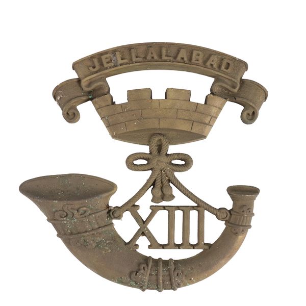 A CAST BRASS PLAQUE FORMED AS THE BADGE OF THE SOMERSET LIGHT INFANTRY