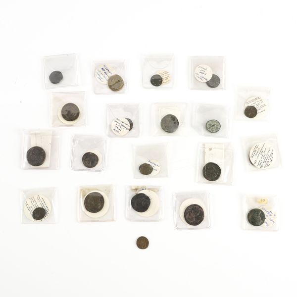 A COLLECTION OF TWENTY MOSTLY ROMAN BRONZE COINS (20)