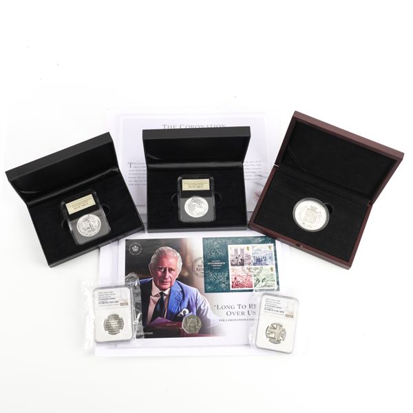 A GROUP OF COMMEMORATIVE FIFTY PENCES AND TWO SILVER ONE OUNCE BRITANNIAS (6)