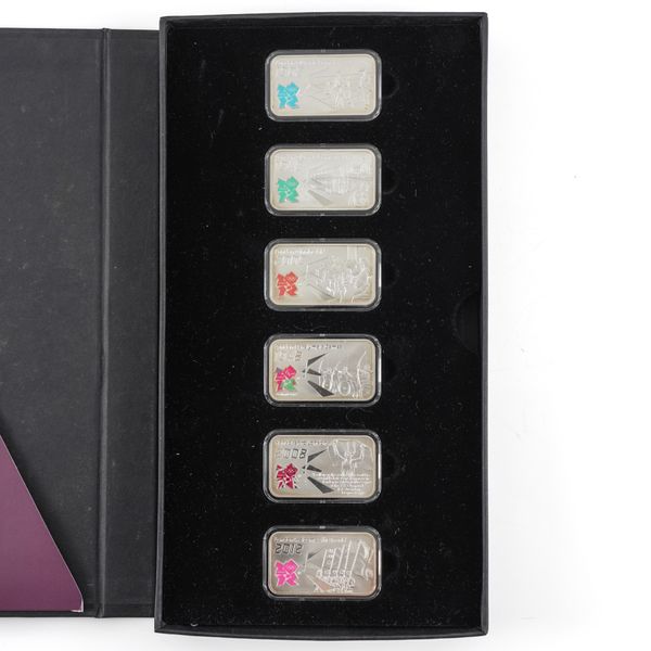 A SET OF SIX SILVER RECTANGULAR INGOTS