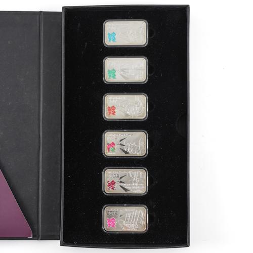 A SET OF SIX SILVER RECTANGULAR INGOTS