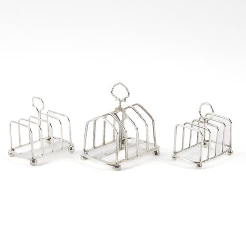 THREE SILVER TOASTRACKS (3)
