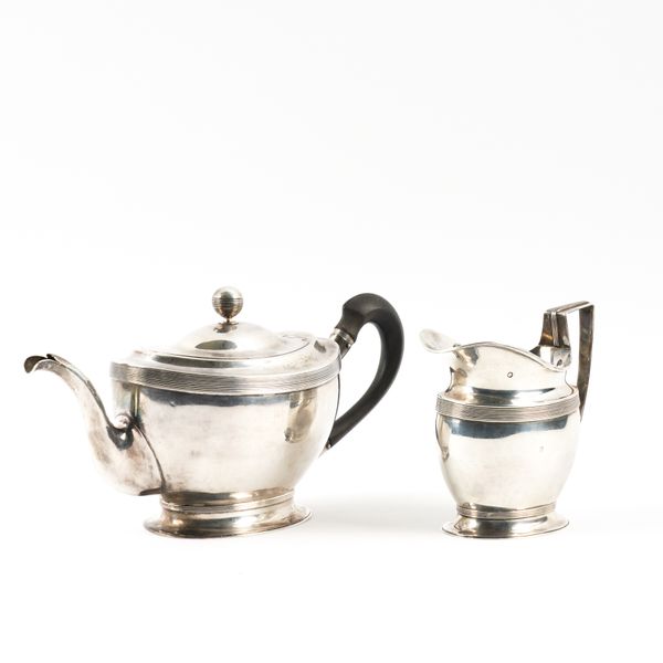 A EUROPEAN SILVER TEAPOT AND A MATCHING MILK JUG (2)