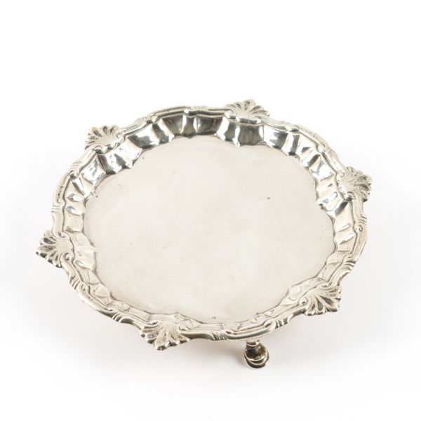 A LATE GEORGE II SILVER SHAPED CIRCULAR WAITER