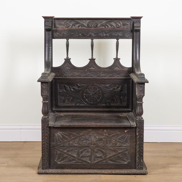 A 17TH CENTURY STYLE OAK SETTLE