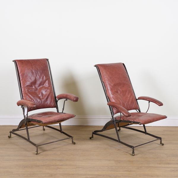 A PAIR OF MID 20TH CENTURY RED LEATHER UPHOLSTERED STEEL FRAMED RECLINING ARMCHAIRS (2)