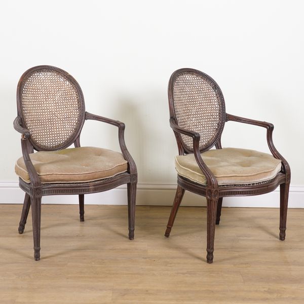 A PAIR OF 19TH CENTURY MAHOGANY FRAMED CANE OPEN ARMCHAIRS (2)