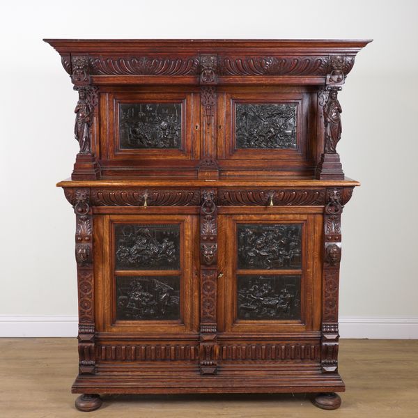 A 19TH CENTURY CARVED OAK AND REUPOUSSE METAL COURT CUPBOARD