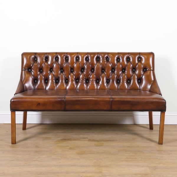 A MODERN BUTTONBACK TAN LEATHER UPHOLSTERED BENCH