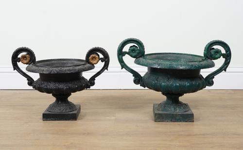 TWO SIMILAR PAINTED CAST-IRON TWIN-HANDLED GARDEN URNS (2)