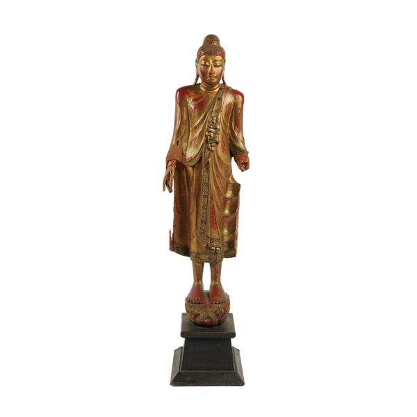 A SOUTH EAST ASIAN GILT-WOOD FIGURE OF A STANDING BUDDHA